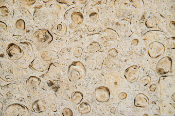 Light brown-beige stone texture. A background with a stone texture that can be copied for design.