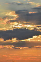 Fiery, dramatic sunset sky with dark clouds and glowing light