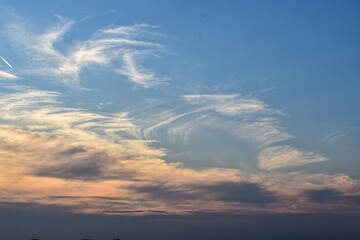 Magical sunset sky in soft pastel colors above quiet horizon