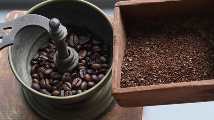 Grinding coffee beans in an old-fashioned grinder for a fresh morning brew