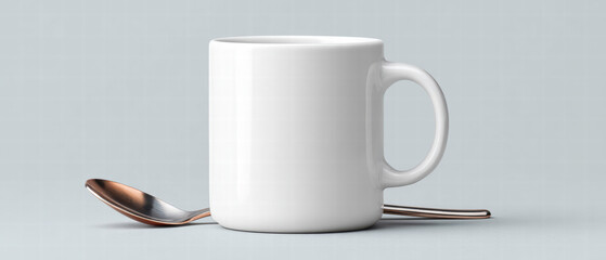 White ceramic coffee mug with metal spoon resting beside it on pale gray surface, minimal still life composition conveying calm and simple morning routine