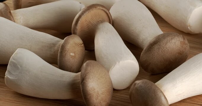 Eryngii (King Oyster Mushrooms) mushrooms close-up footage on rotating table.