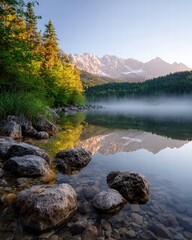 Serene Mountain Lake with Autumn Foliage and Snow-Capped Peaks