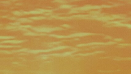 Abstract textured background with warm orange and yellow tones