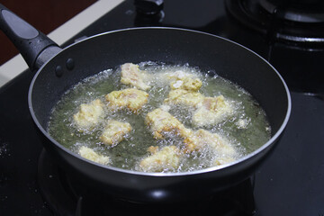 Crispy Chicken Frying in Hot Oil