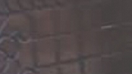 Close up of a rough textured fabric surface with subtle color variations