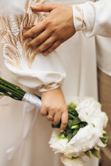 bride and groom holding hands