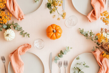 Minimalist Autumn Table Setting with Pumpkins