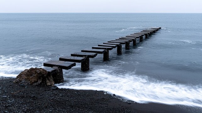 A weathered wooden pier extends into a gray, stormy sea - Powered by Adobe