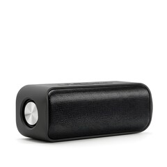 Naklejka premium A modern black portable wireless bluetooth speaker for music and audio, isolated on a clean white background with a metallic silver button