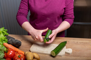 Woman Preparing a Healthy Meal with Fresh Vegetables in the Kitchen