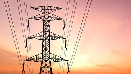 Energy Conduit: A towering electricity pylon stands silhouetted against a vibrant sunset sky, carrying power lines that deliver energy to homes and industries alike.