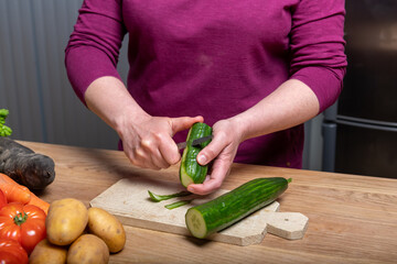 Woman Preparing a Healthy Meal with Fresh Vegetables in the Kitchen