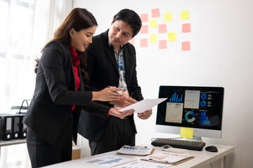 Business people working and discussing financial chart at office desk