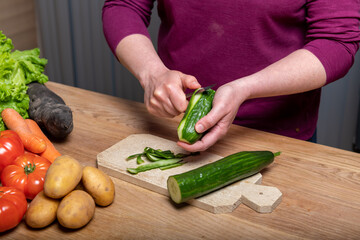 Woman Preparing a Healthy Meal with Fresh Vegetables in the Kitchen