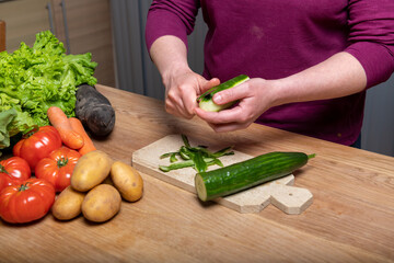 Woman Preparing a Healthy Meal with Fresh Vegetables in the Kitchen