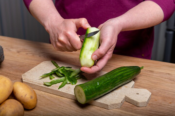 Woman Preparing a Healthy Meal with Fresh Vegetables in the Kitchen