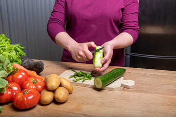 Woman Preparing a Healthy Meal with Fresh Vegetables in the Kitchen