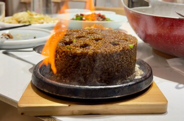 Flaming Fried Rice Served on Hot Iron Plate