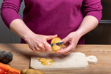 Woman Preparing a Healthy Meal with Fresh Vegetables in the Kitchen