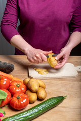 Woman Preparing a Healthy Meal with Fresh Vegetables in the Kitchen