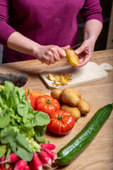 Woman Preparing a Healthy Meal with Fresh Vegetables in the Kitchen