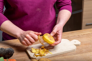 Woman Preparing a Healthy Meal with Fresh Vegetables in the Kitchen