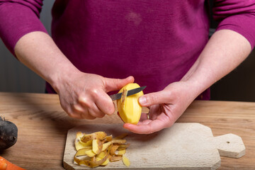 Woman Preparing a Healthy Meal with Fresh Vegetables in the Kitchen