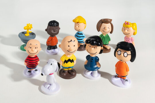 Charlie Brown and Snoopy figurines posing together