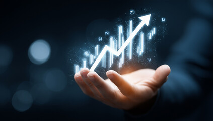Open hand holding bright white upward trending graph with dark background and glowing light effects