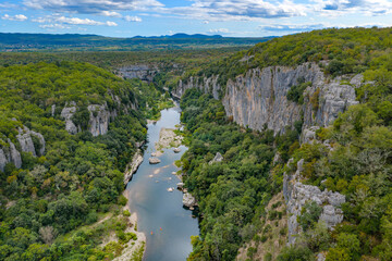 Fototapeta premium The Ardèche River Flowing Through the Dramatic Gorges de l'Ardèche