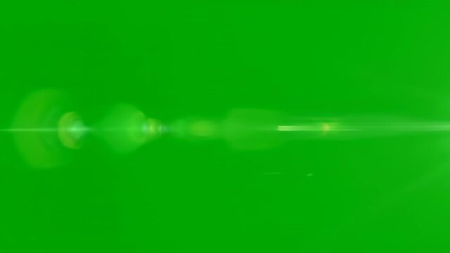 A fast-moving optical flare zapping and streaking across a solid green screen, creating a dynamic light effect shimmer, visual effect, motion graphic