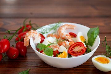 Healthy lunch with shrimp, cheese and fresh tomatoes