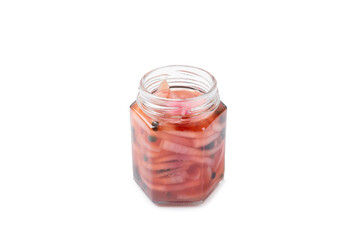 Pickled onions in a glass jar isolated on a white background. Pickled red onions. Vegetarian spicy dish. Delicious homemade pickled purple onions. Space for text. Space for copy.