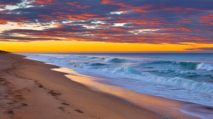 Obraz premium A breathtaking tropical beach sunset with vibrant clouds and golden reflections on the wet sand.