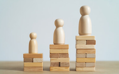 Three wooden peg dolls representing growth and success arranged on stacking blocks illustration