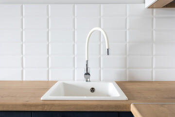 kitchen faucet on a stylish metal sink