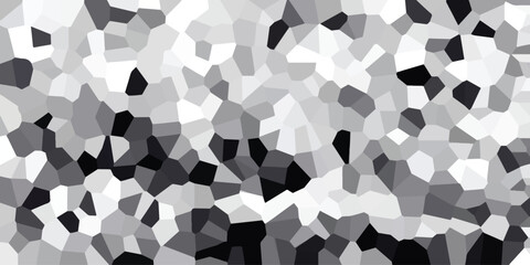 Abstract geometric mosaic pattern in grayscale with irregular polygonal shapes and varying shades of black white and gray creating a dynamic visual texture for backgrounds