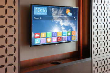 TV set showing menu with icons and information on display in room