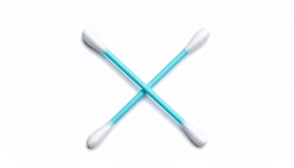 Obraz premium Two blue-handled cotton swabs—crossed in an “X” shape on a white surface—evoke crafted hygiene, symbolic precision, and the rhythm of minimal care and symmetrical clarity.