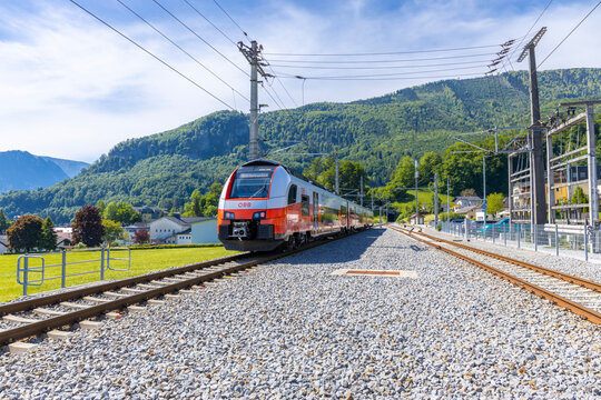 Vienna, Austria - 06.06.2025: &Ouml;BB train at Vienna station. Passenger train on railway platform in urban transport hub. Travel, public transportation, city infrastructure commuting of Austria OBB