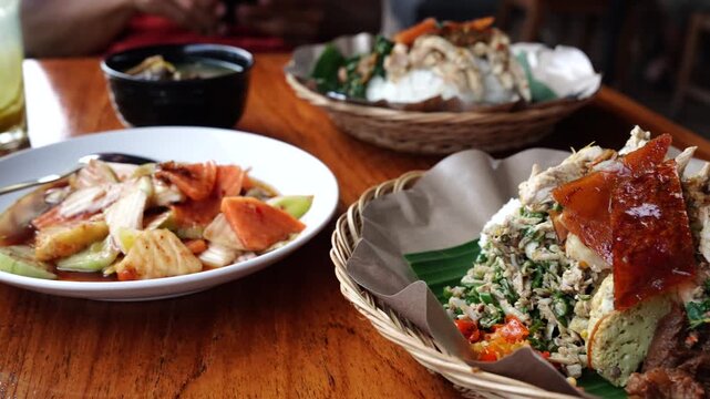 Mixed rice babi guling with rojak fruit salad Balinese food