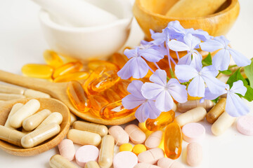 Alternative medicine herbal organic capsule with vitamin E omega 3 fish oil, mineral, drug with herbs leaf natural supplements for healthy good life.