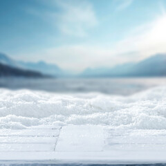 Snow covered copy space for product placement and snowy mountain landscape in the heart of winter, with tree-covered slopes and frosty pine forests under  bright winter sky.