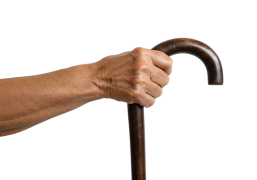 Senior man's hand gripping wooden walking cane against a white backdrop, showcasing support and stability with a sense of aging gracefully.