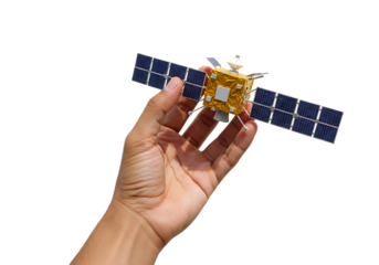 Hand holds a miniature satellite against a white backdrop, showcasing technology and innovation with a sense of scale and wonder.