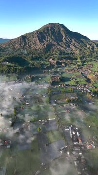 Foggy morning at of Mt. Batur scenery from Pinggan village Kintamani, Indonesia
