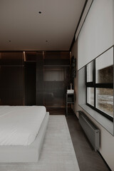 Sleek and stylish bedroom with contemporary design, featuring horizontal blinds, soft lighting, and a clean, calm ambiance.