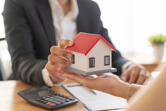 Hand of landlord, realtor pointing sign signature contract rental, purchase, buyer home or apartment with tenant, client after banker agreement mortgage, loan success or done. Property agent concept.