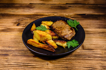 Roasted beefsteak with the fried potato and parsley